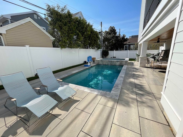 view of pool featuring ceiling fan, an in ground hot tub, and a patio