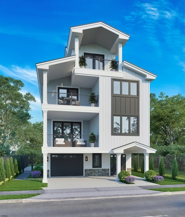 contemporary home featuring a balcony and a garage