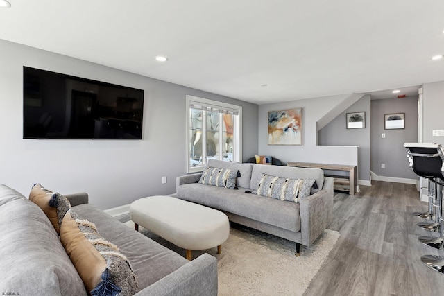 living room with light hardwood / wood-style flooring