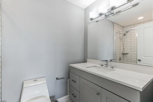 bathroom featuring toilet and vanity with extensive cabinet space