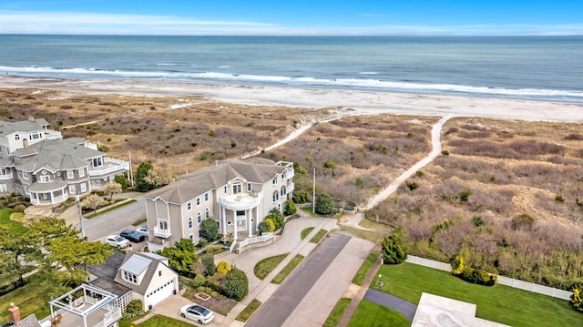 bird's eye view featuring a beach view and a water view