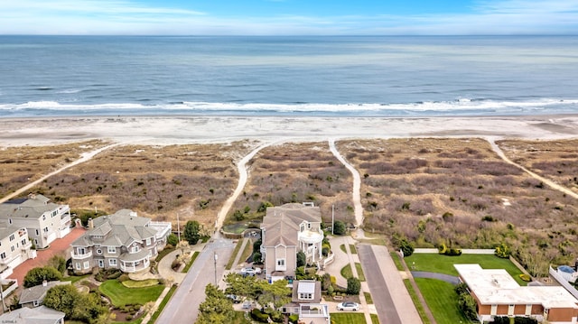 bird's eye view with a view of the beach and a water view