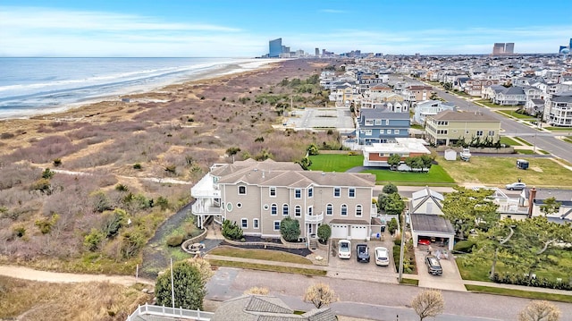 bird's eye view with a view of the beach and a water view