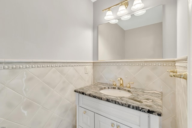 bathroom with tile walls, backsplash, and vanity with extensive cabinet space