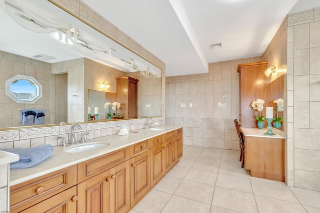 bathroom with double sink, oversized vanity, tile walls, and tile flooring