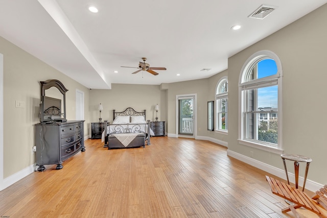 bedroom with ceiling fan and light wood-type flooring