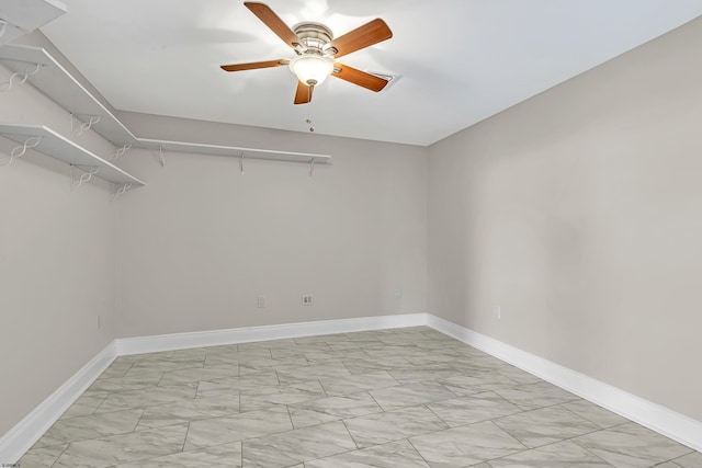 interior space with ceiling fan