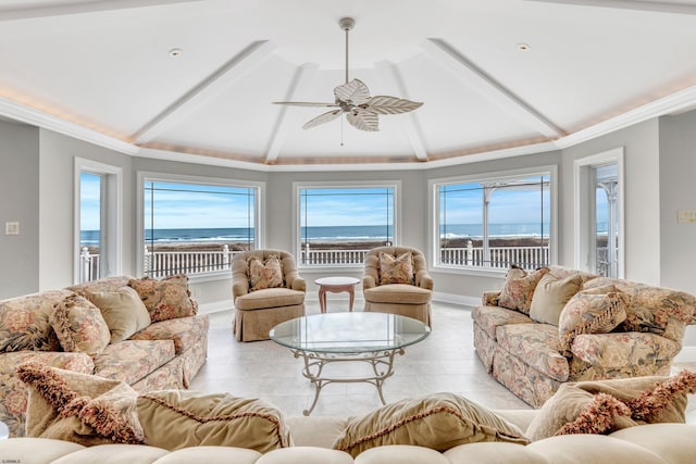 tiled living room featuring vaulted ceiling, ceiling fan, a water view, and crown molding