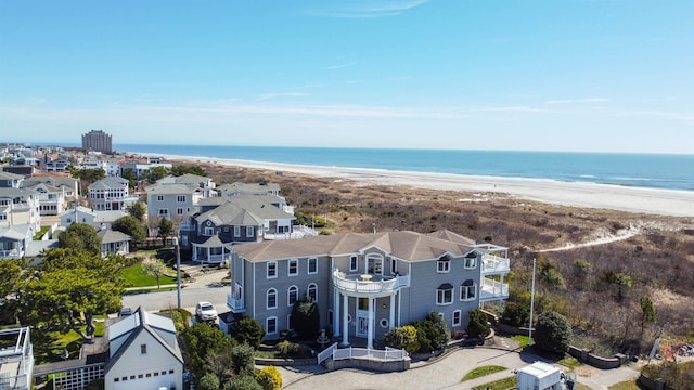 bird's eye view with a beach view and a water view