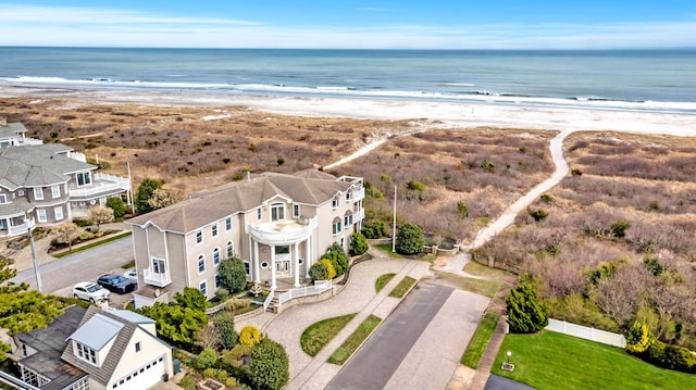 bird's eye view featuring a beach view and a water view