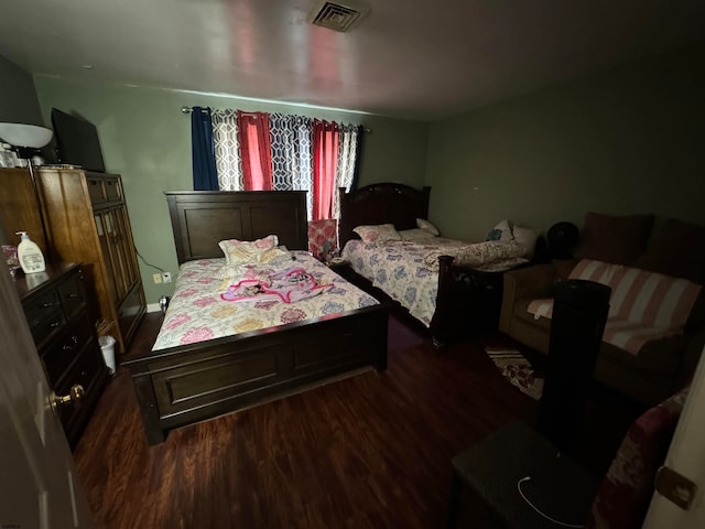 bedroom featuring dark wood-type flooring