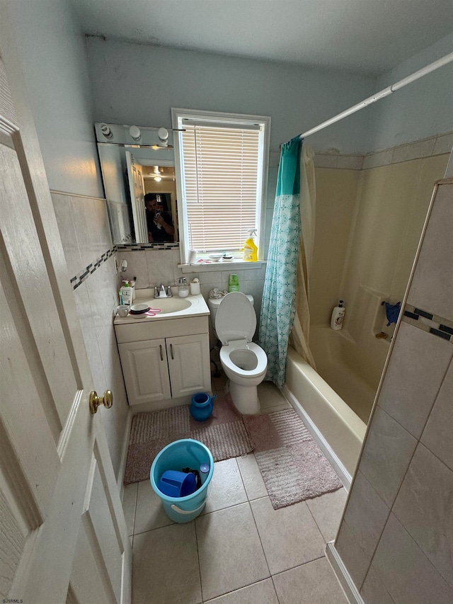 full bathroom with tile flooring, tile walls, shower / bath combination with curtain, toilet, and vanity