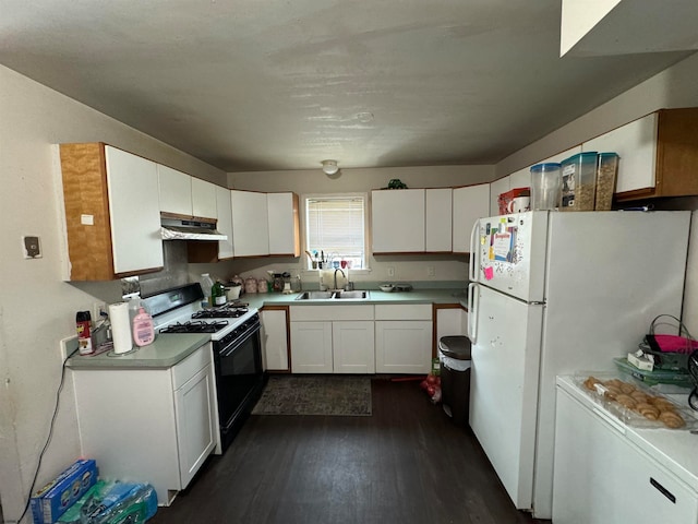 kitchen with white cabinets, dark hardwood / wood-style flooring, and white appliances