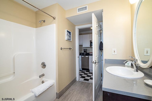 bathroom with shower / bath combination, vanity, and tile flooring