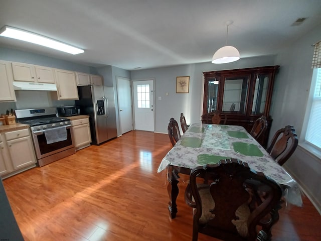 dining area with light hardwood / wood-style flooring