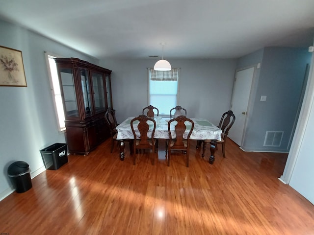 dining space featuring hardwood / wood-style floors