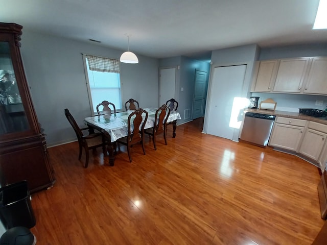 dining area with light wood-type flooring