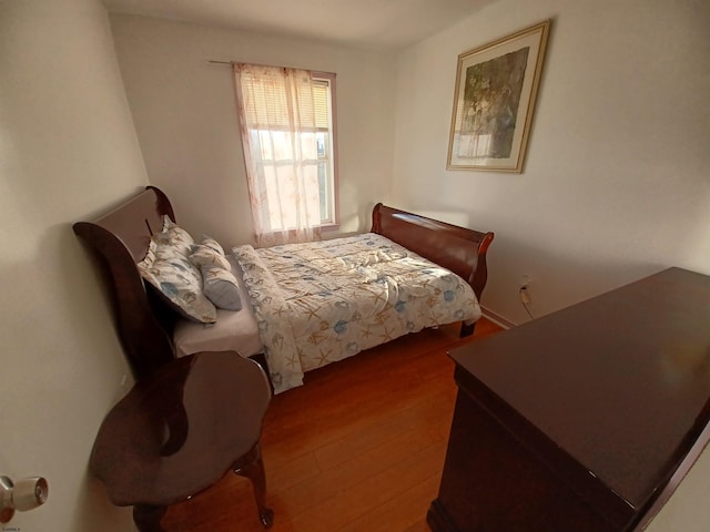 bedroom featuring hardwood / wood-style floors