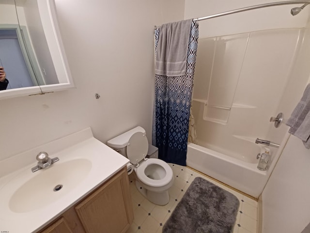 full bathroom featuring vanity, tile floors, toilet, and shower / bath combo with shower curtain