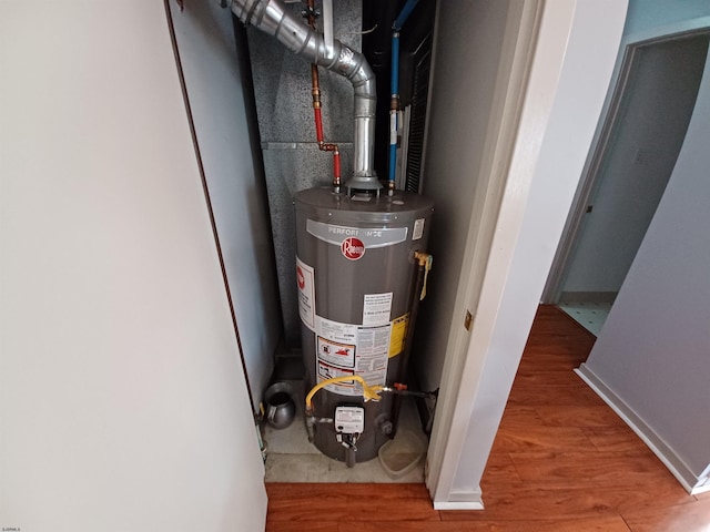 utility room featuring gas water heater