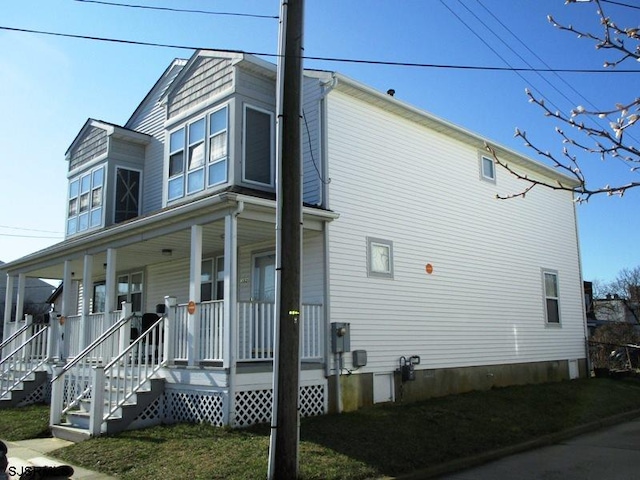 view of property exterior featuring a porch