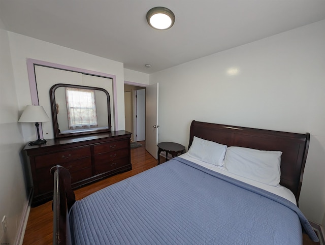 bedroom featuring dark wood-type flooring