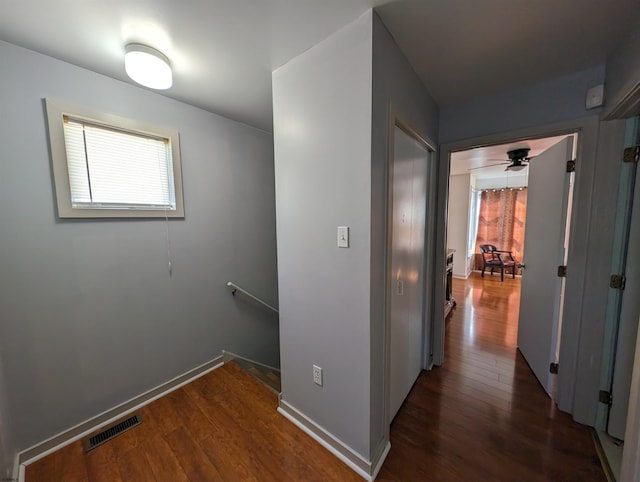 hall with dark hardwood / wood-style flooring