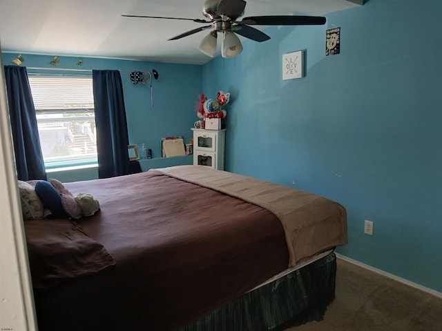 bedroom with ceiling fan and carpet flooring