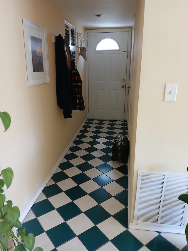 doorway to outside with tile flooring