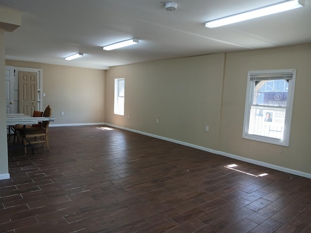 unfurnished room with dark hardwood / wood-style floors