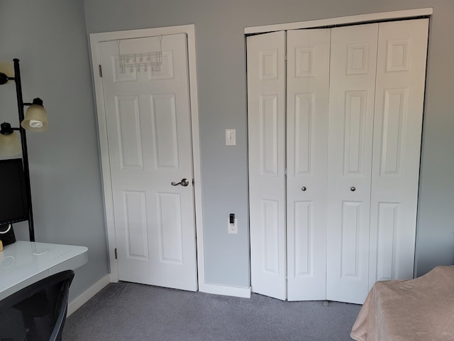 bedroom with dark carpet