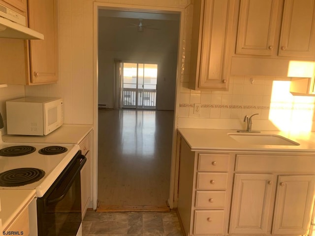 kitchen with backsplash, sink, white appliances, and light tile floors