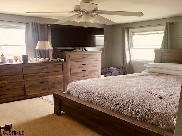 bedroom featuring carpet flooring and ceiling fan