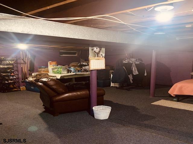 basement with carpet flooring