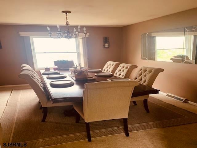 dining room with a notable chandelier