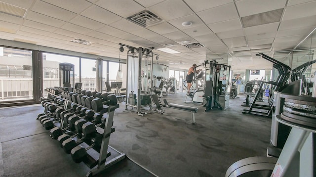 workout area featuring a drop ceiling and visible vents