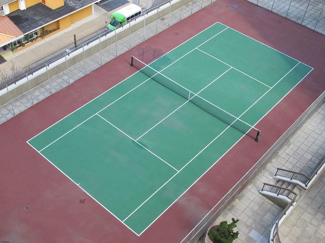 view of sport court with fence