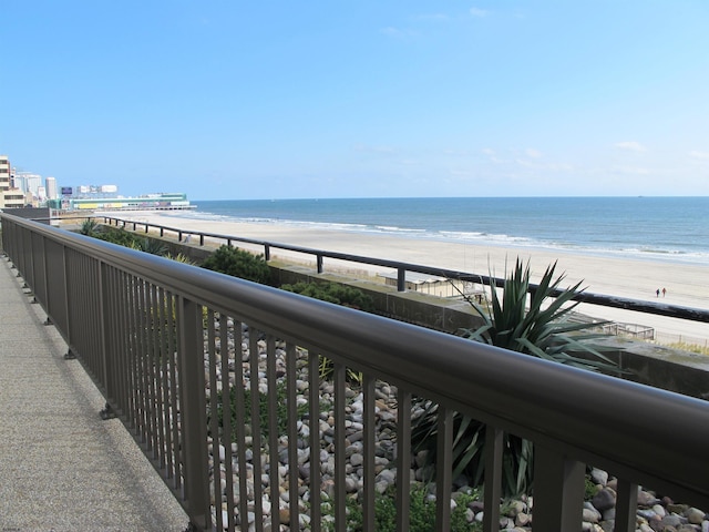 balcony with a view of the beach and a water view