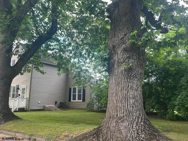 view of home's exterior with a lawn