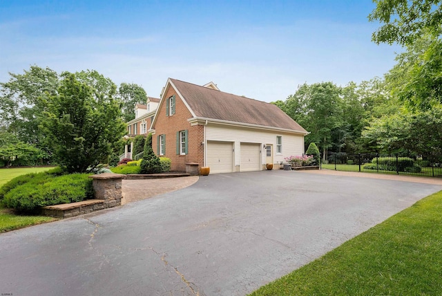 view of side of property featuring a garage