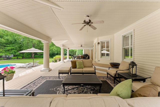 view of patio with an outdoor living space and ceiling fan