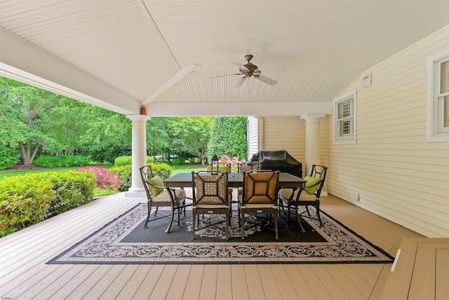 wooden terrace with ceiling fan and a grill