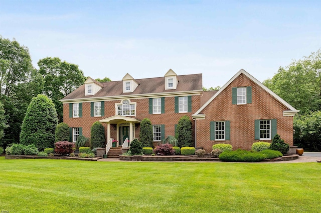 colonial inspired home with a front yard