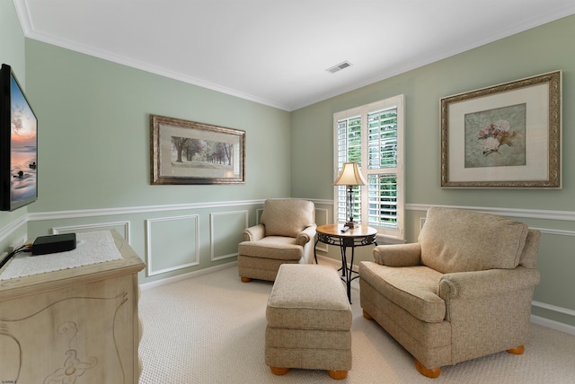 sitting room featuring light carpet and crown molding