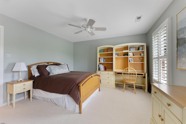 bedroom with ceiling fan and light colored carpet