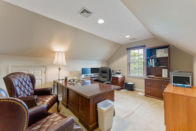 carpeted office space featuring lofted ceiling