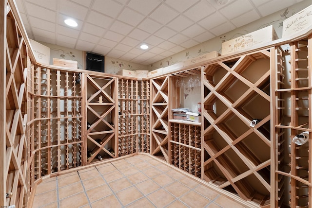 wine area featuring a paneled ceiling