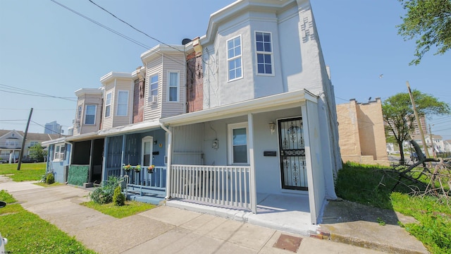 multi unit property featuring a porch