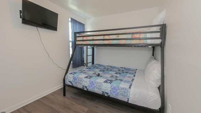 bedroom with hardwood / wood-style floors