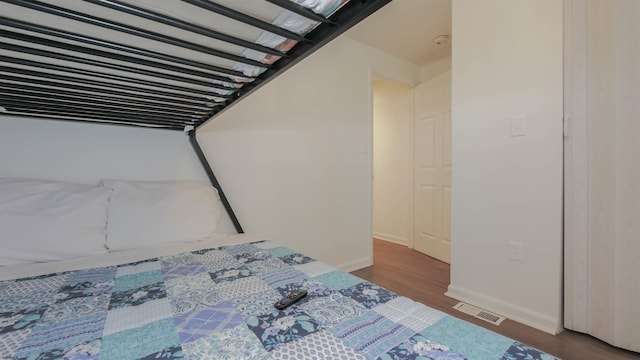 unfurnished bedroom featuring dark wood-type flooring